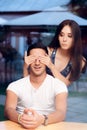 Woman Covering ManÃ¢â¬â¢s Eyes Taking him by Surprise on a Blind Date Royalty Free Stock Photo